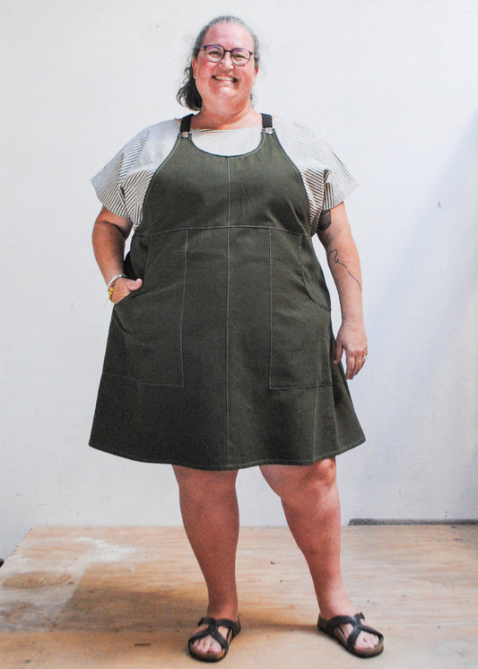 Model wearing evergreen suspender dress in size 5XL, 5'10" with 59" bust