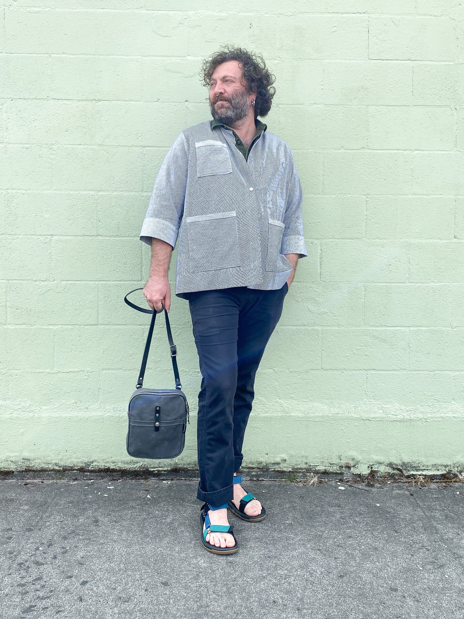 Male model in railroad stripe denim Lab Coat.