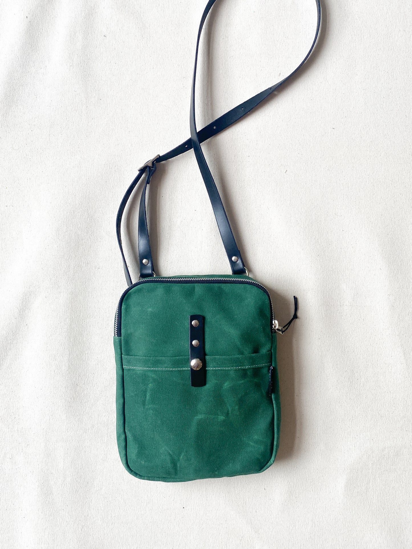 Waxed Canvas Mini Messenger in hunter.