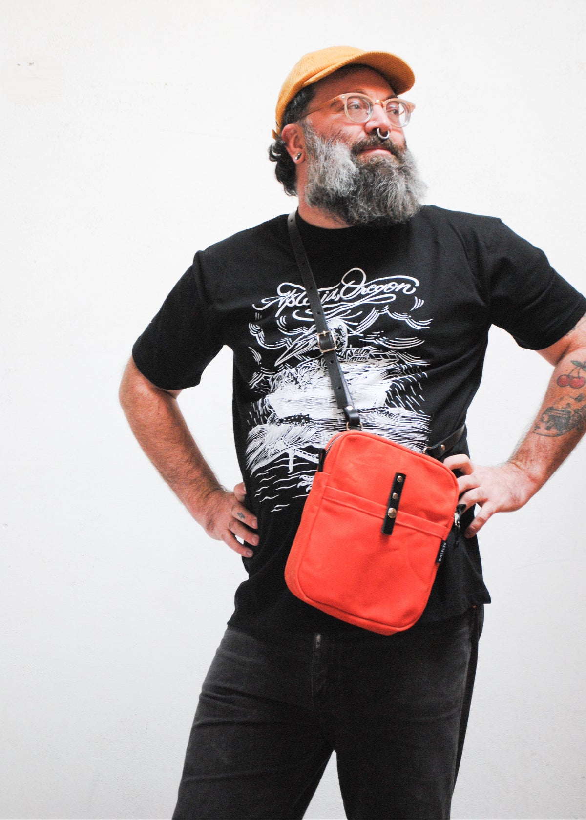 Close up of mini messenger crossbody bag