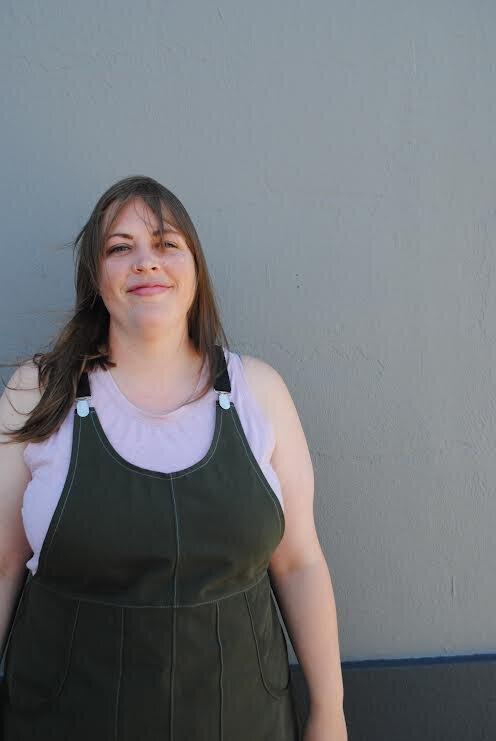 Evergreen Suspender Dress, cropped front view, on model.