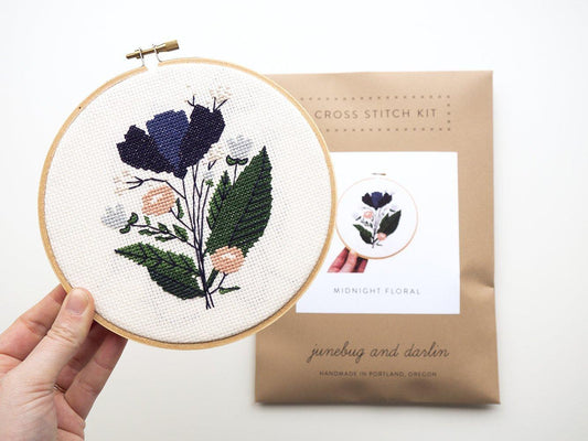 Midnight Floral Cross Stitch Kit, finished on hoop with package.