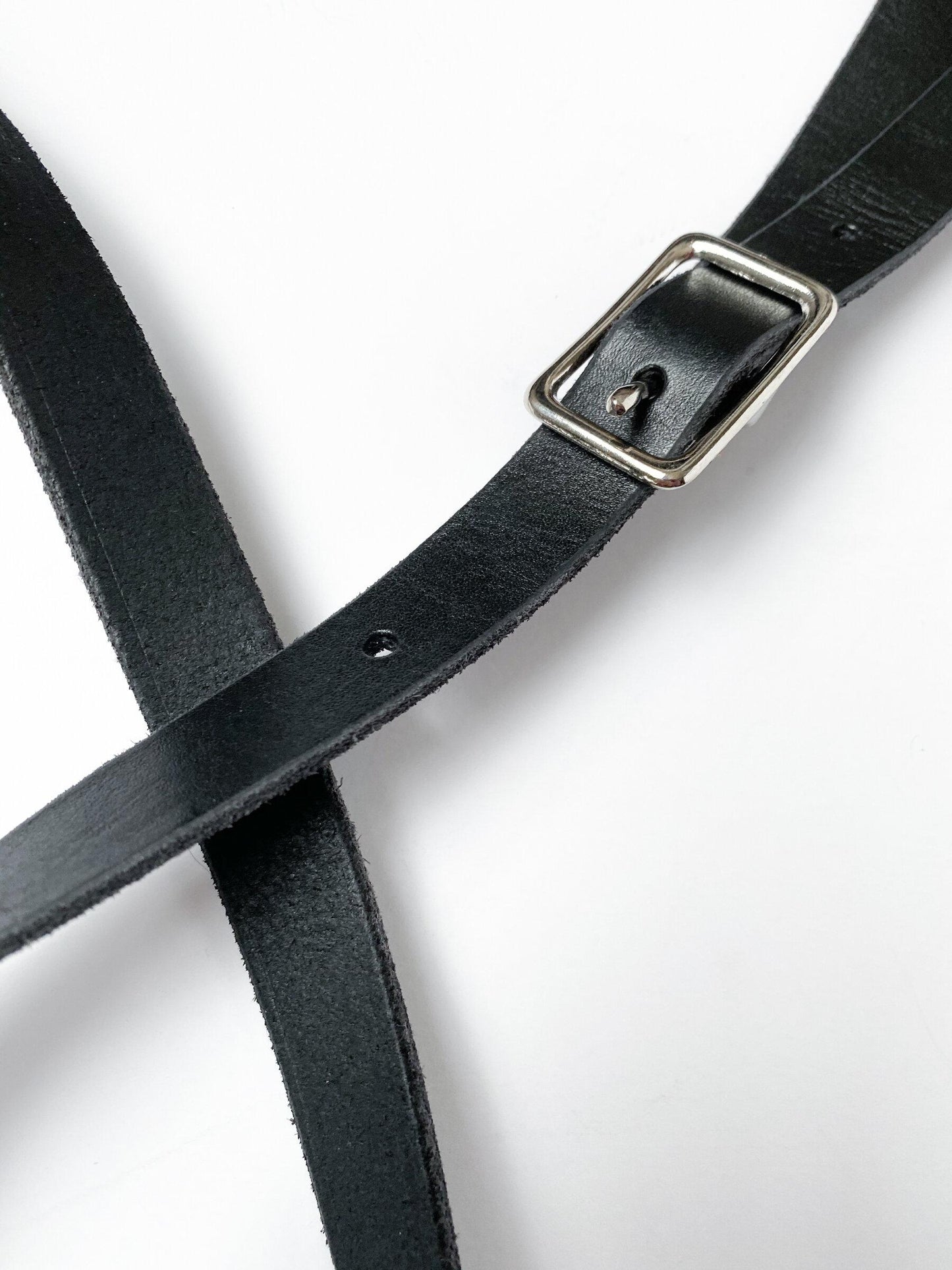 Mini messenger, black leather strap and buckle hardware.