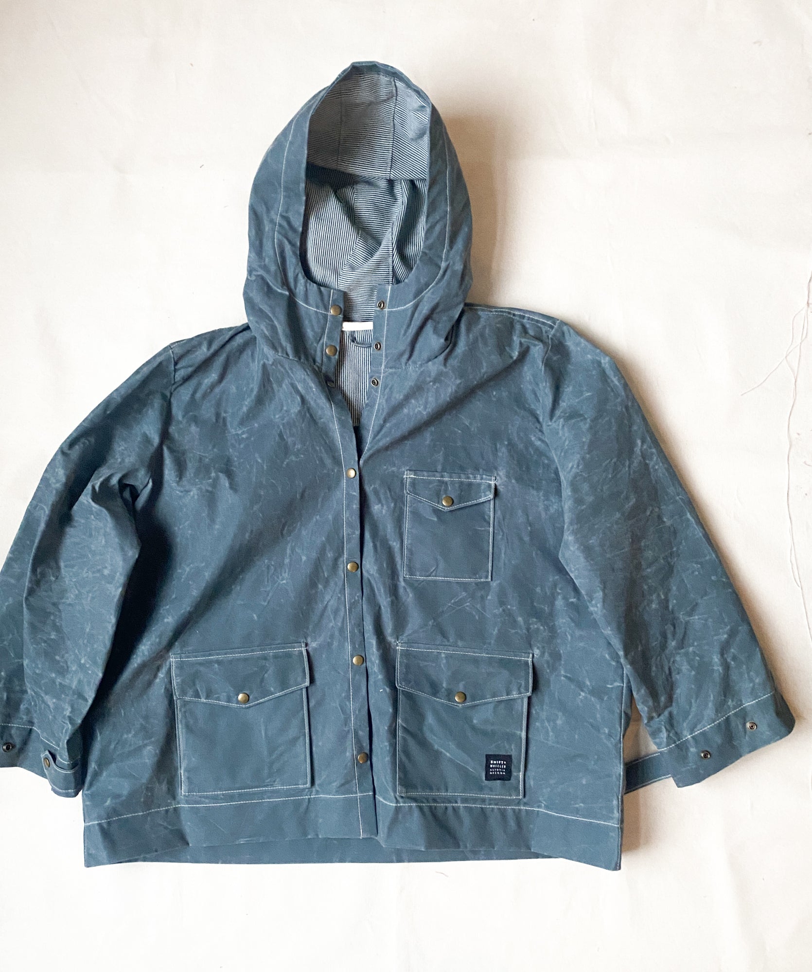 Zipped Waxed Canvas Raincoat in Slate. 