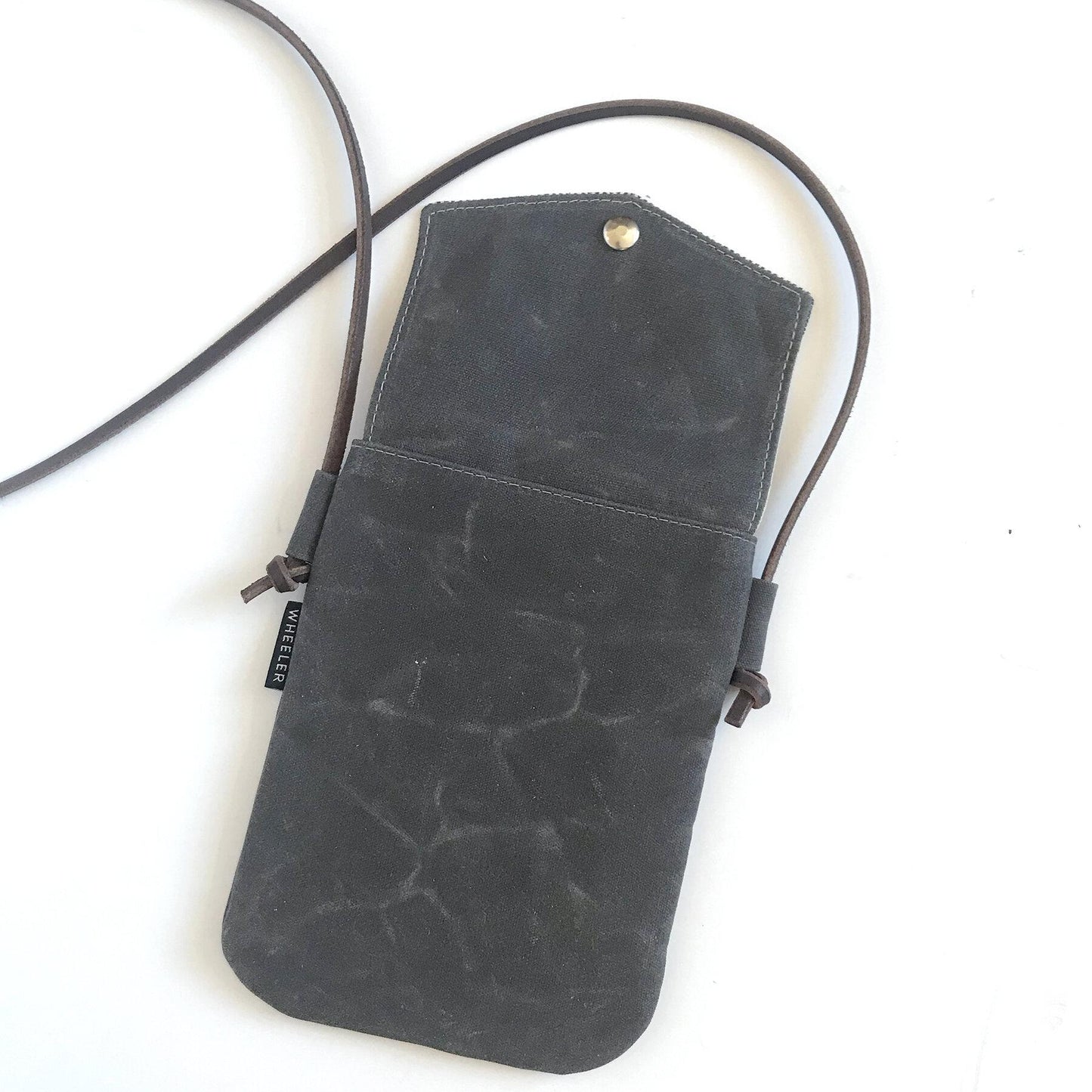 Charcoal, waxed cotton canvas, simple crossbody bag, back view.