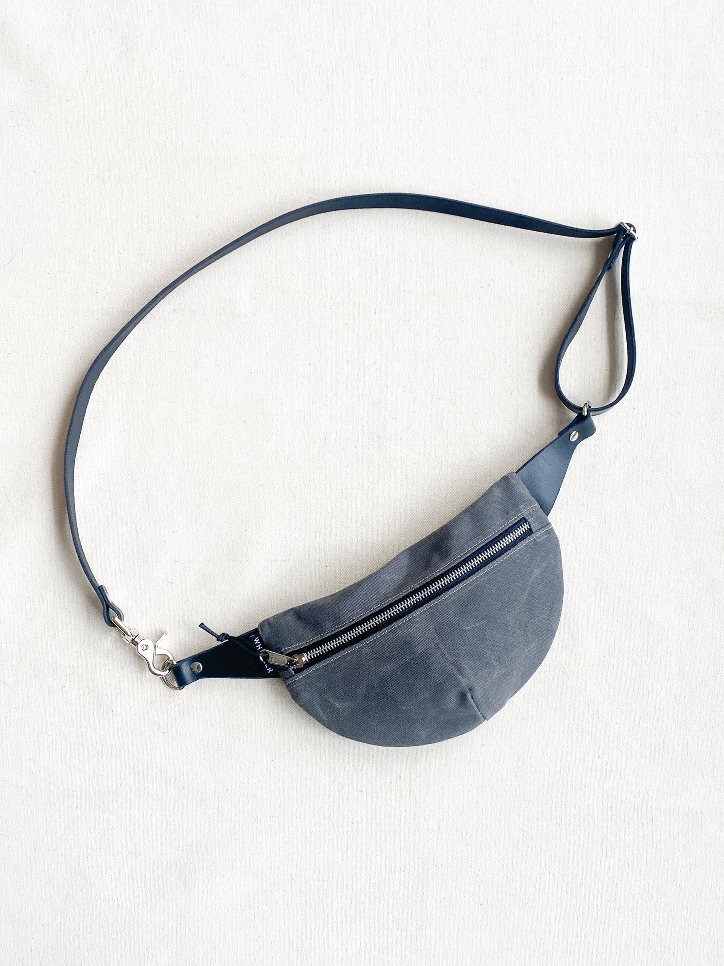 Grey waxed canvas fanny pack with black leather