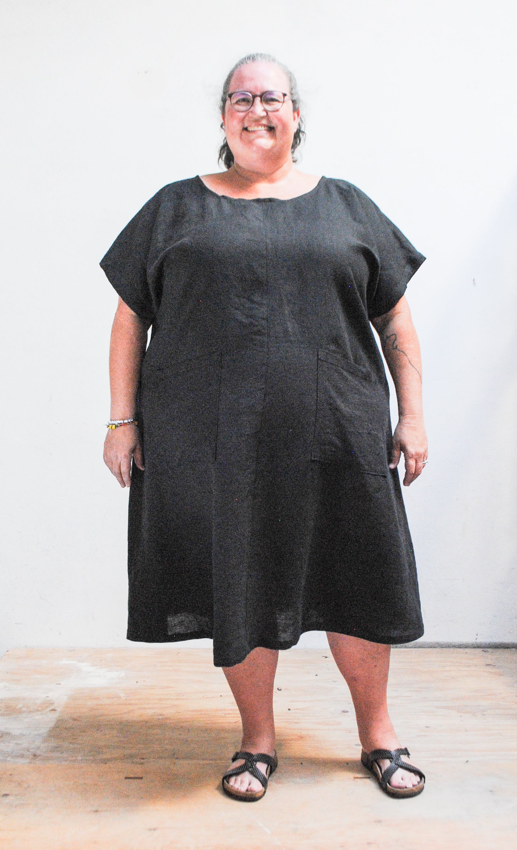 Model wearing black linen dress in size 5XL, 5'10" with 59" bust