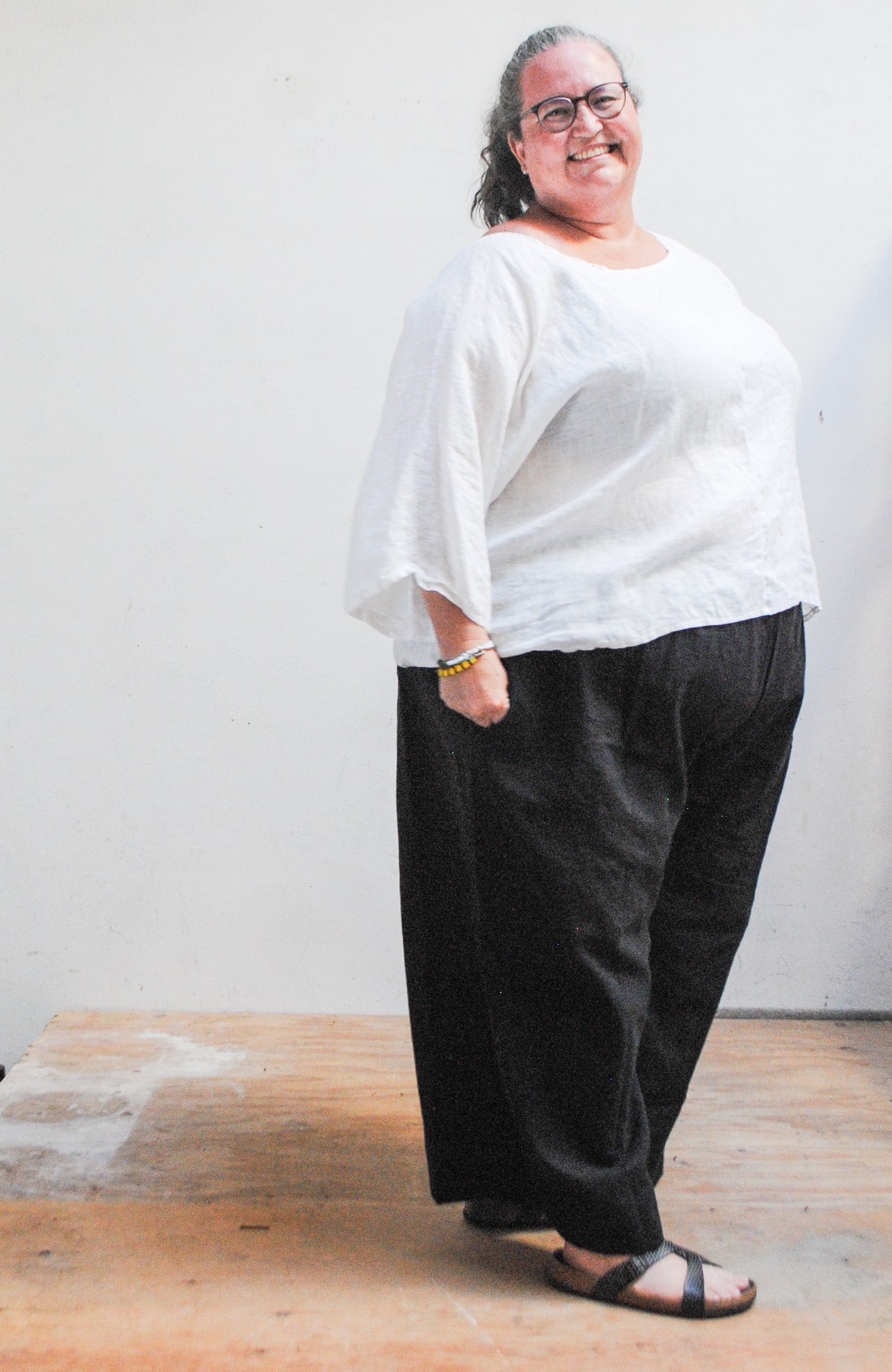 Wide sleeves on sheer white linen oversized shirt by Shift + Wheeler