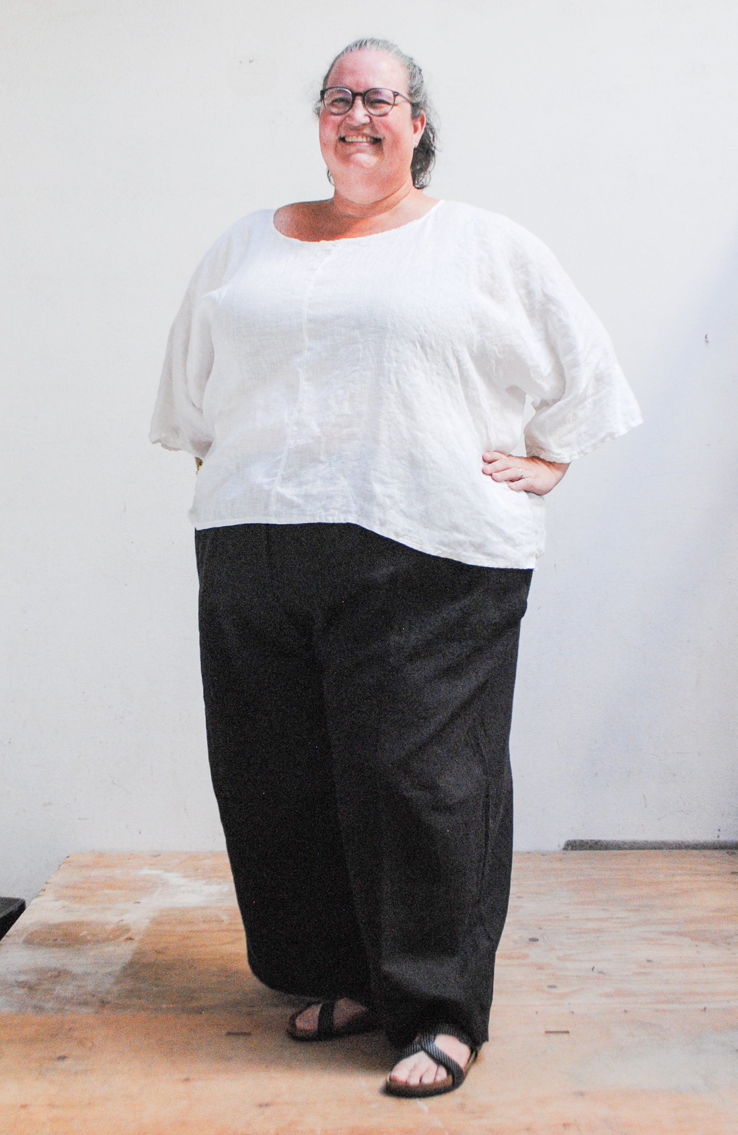 Model Wearing 4XL white linen ghost shirt.