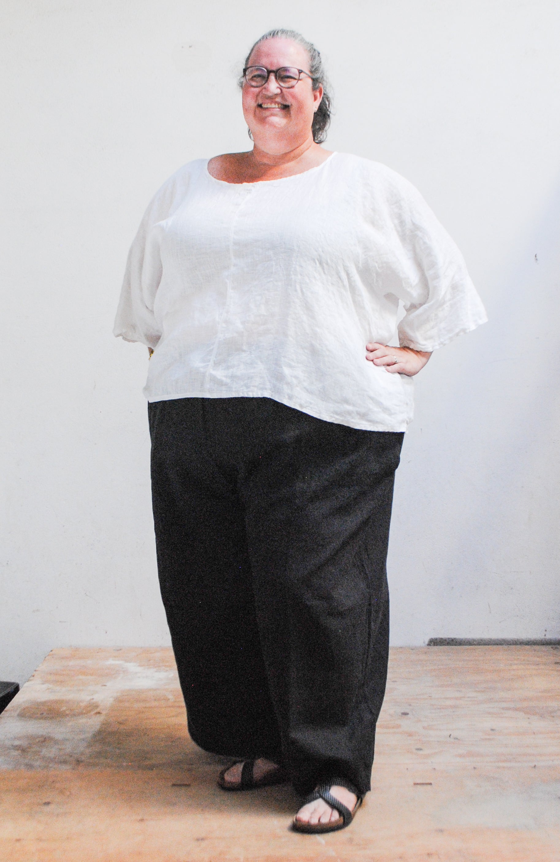 Model Wearing 4XL white linen ghost shirt.