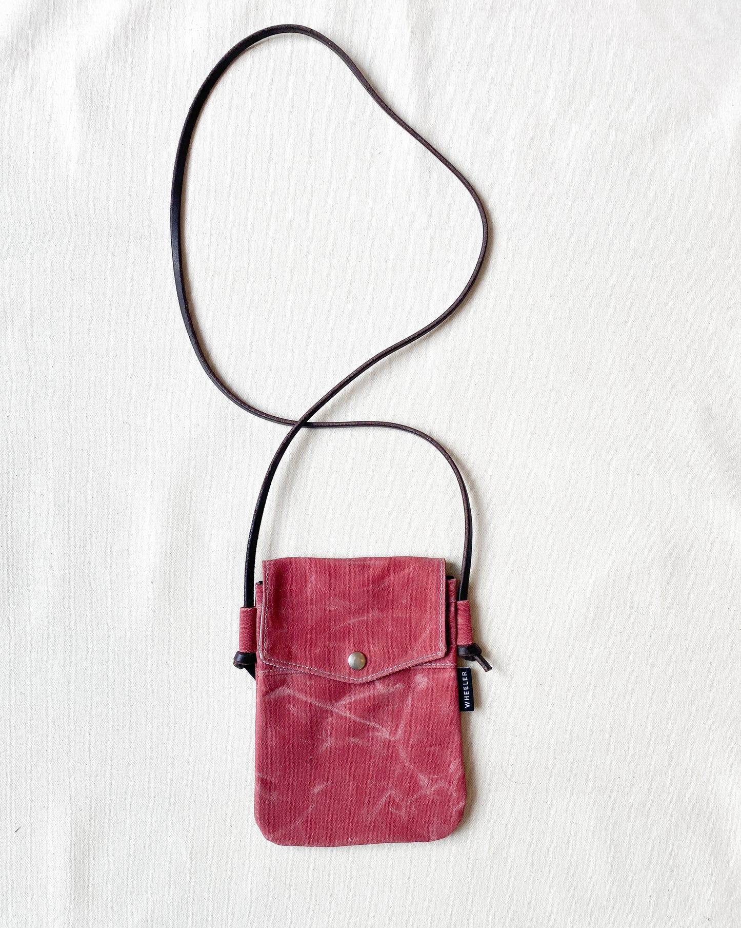 Waxed Canvas Simple Crossbody in all red.