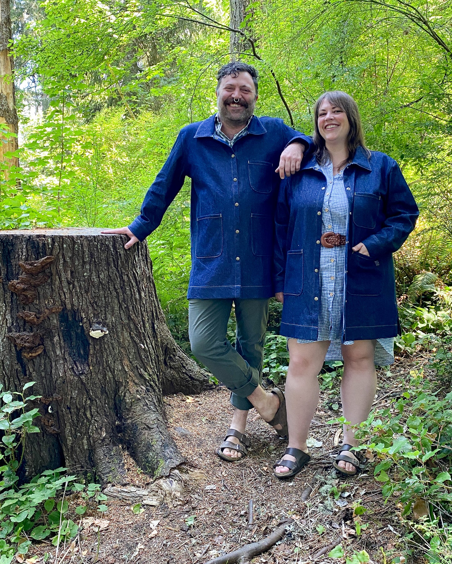 Male and female models both wearing the Large Denim Jacket. 