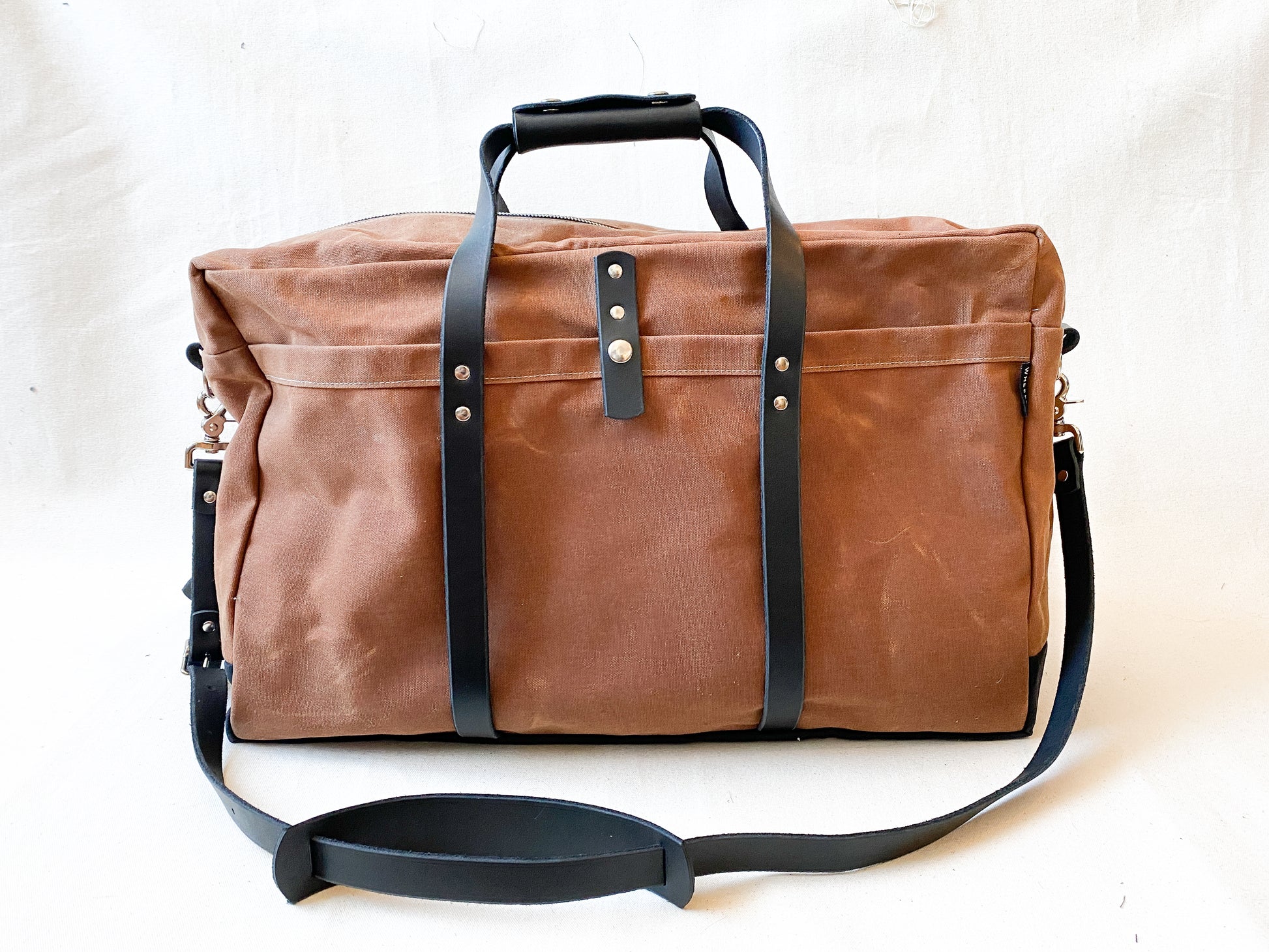 Carry-on Duffel in tan with dark brown leather. 