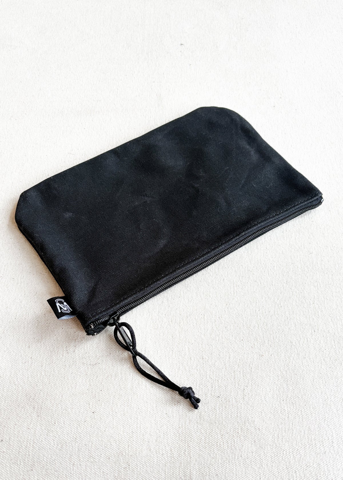 Large waxed canvas zipper pouch in black