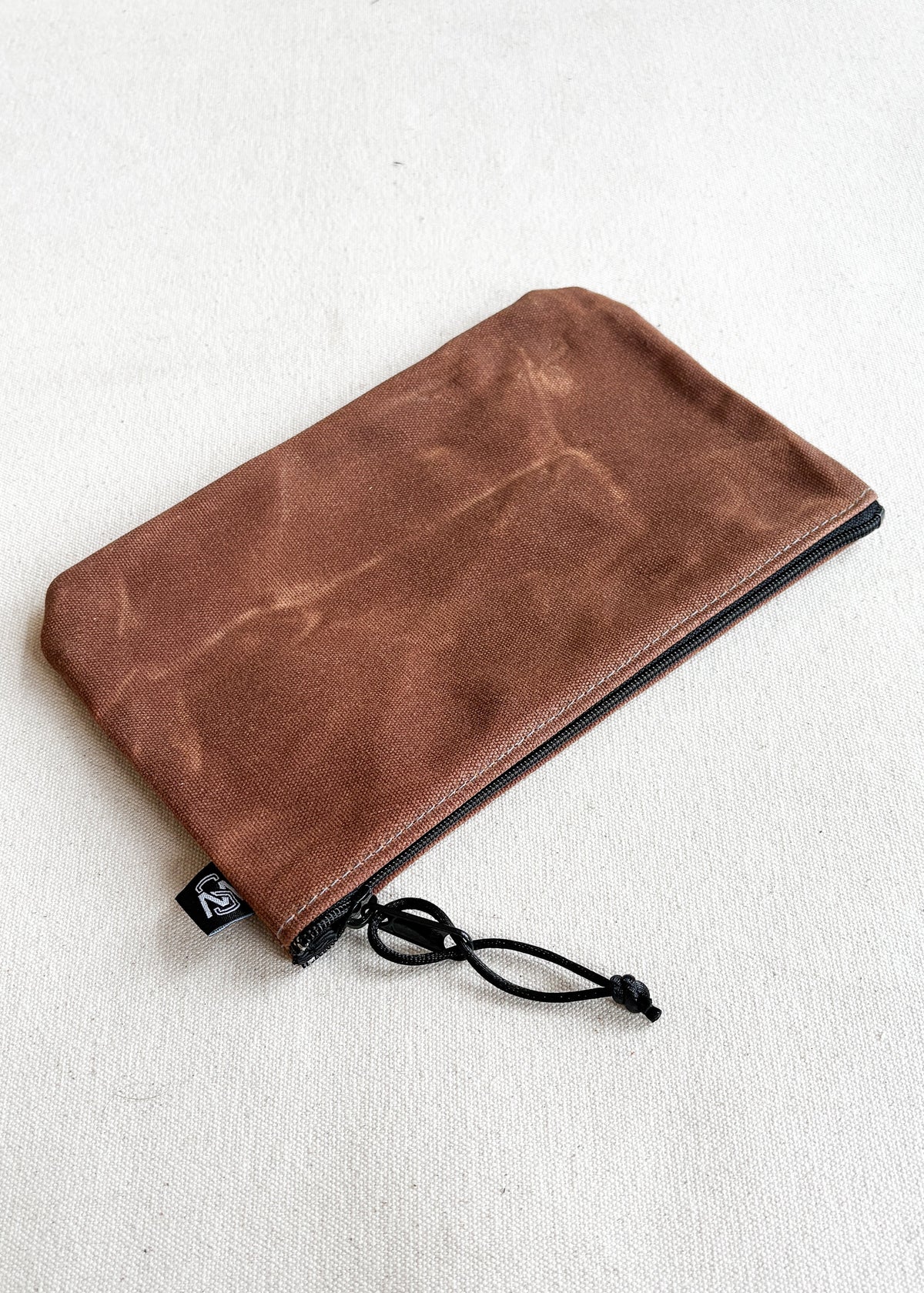 Large waxed canvas zipper pouch in brown