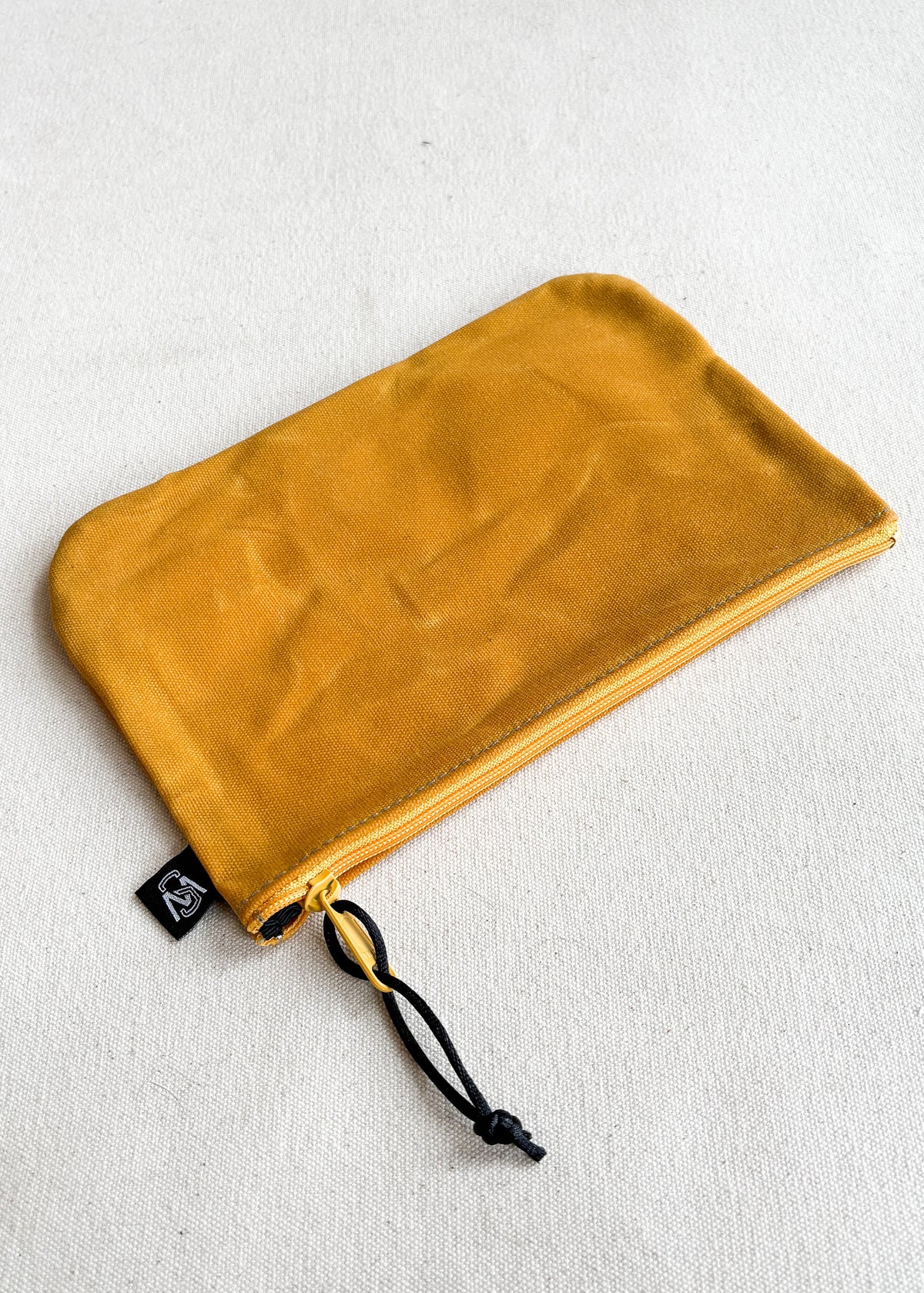 Large waxed canvas zipper pouch in gold