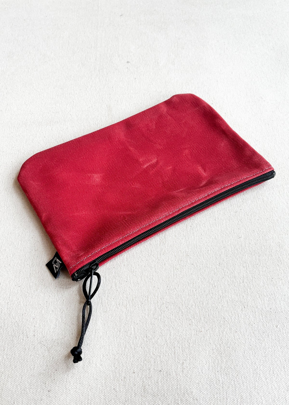 Large waxed canvas zipper pouch in red