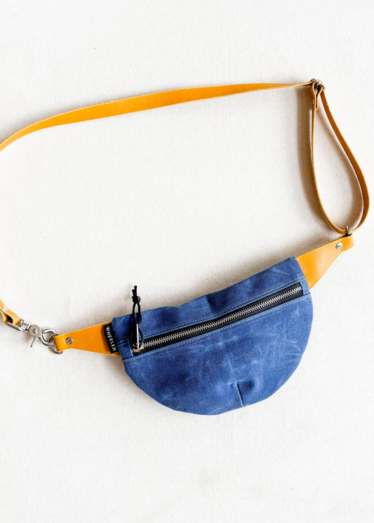 Made-to-order blue canvas fanny pack with yellow leather strapping
