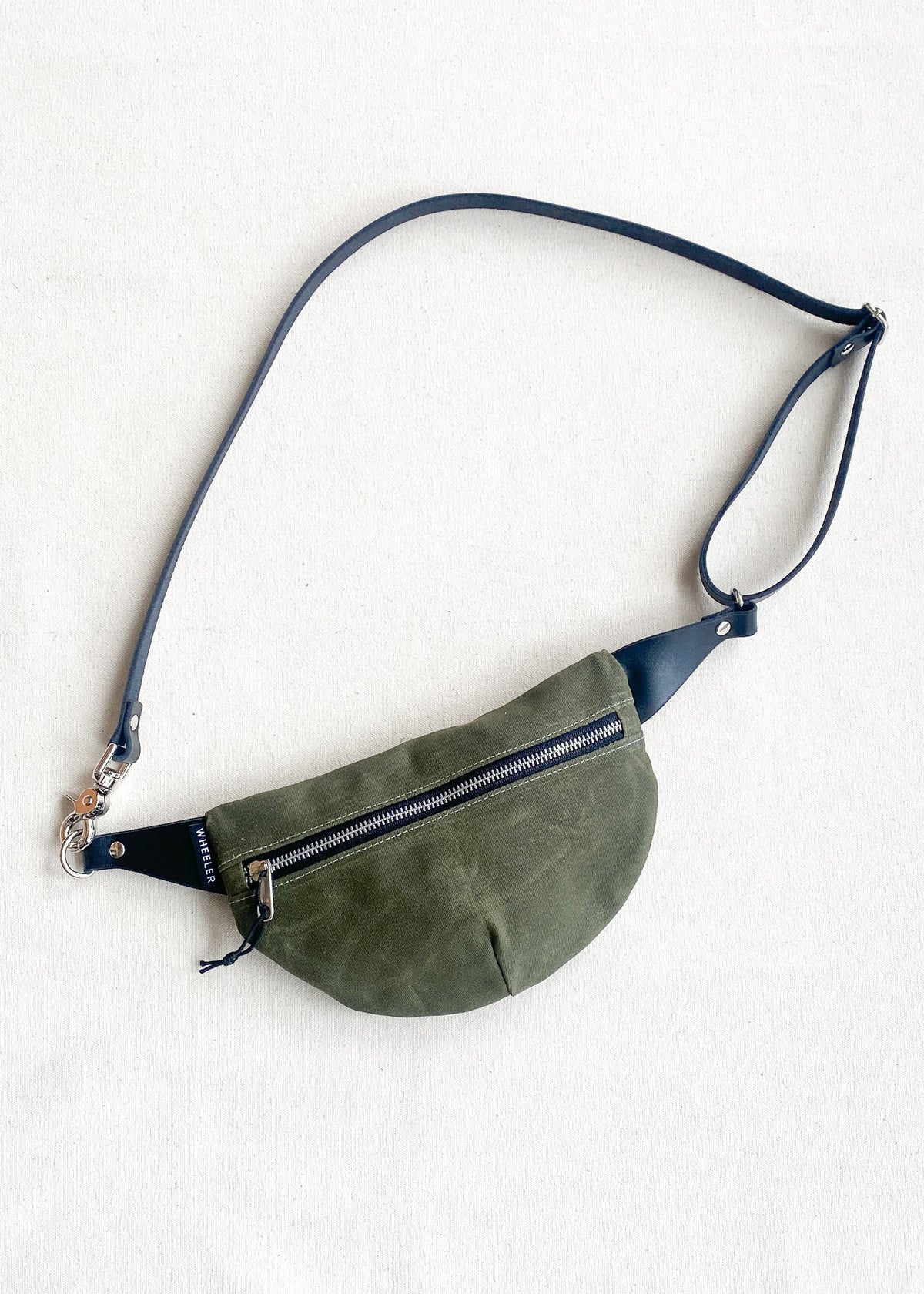 Made-to-order olive fanny pack with black leather strapping