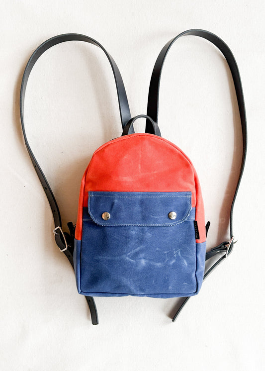 2-tone orange and royal handmade Shift + Wheeler waxed canvas mini backpack 