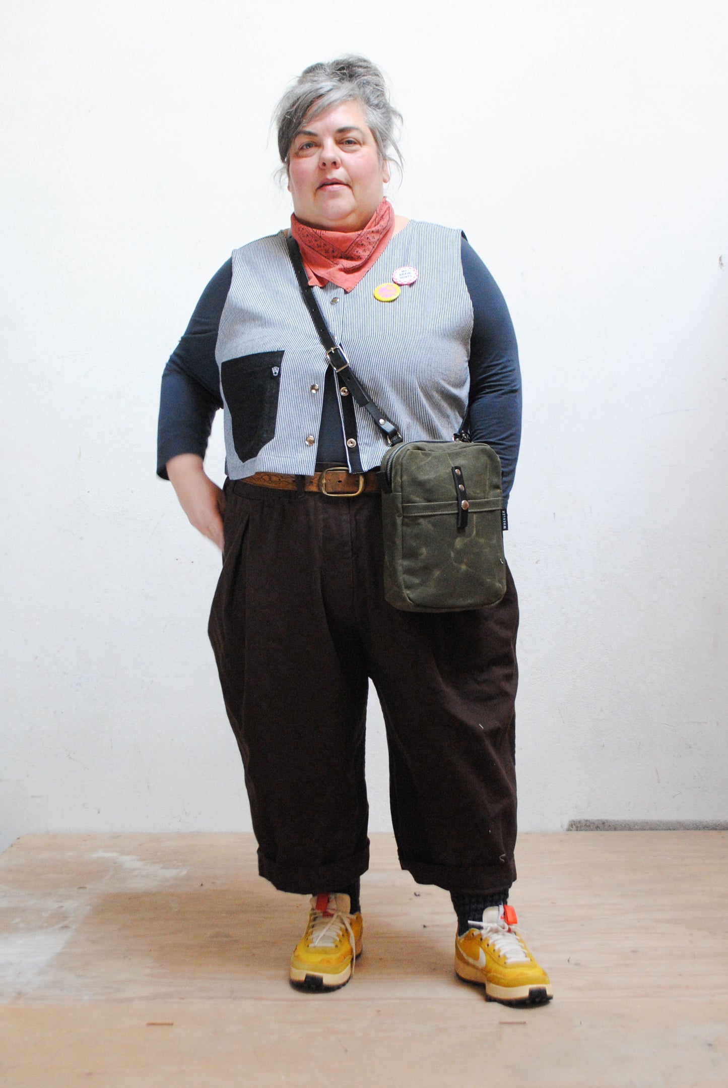 Waxed canvas mini messenger is a versatile crossbody bag. 