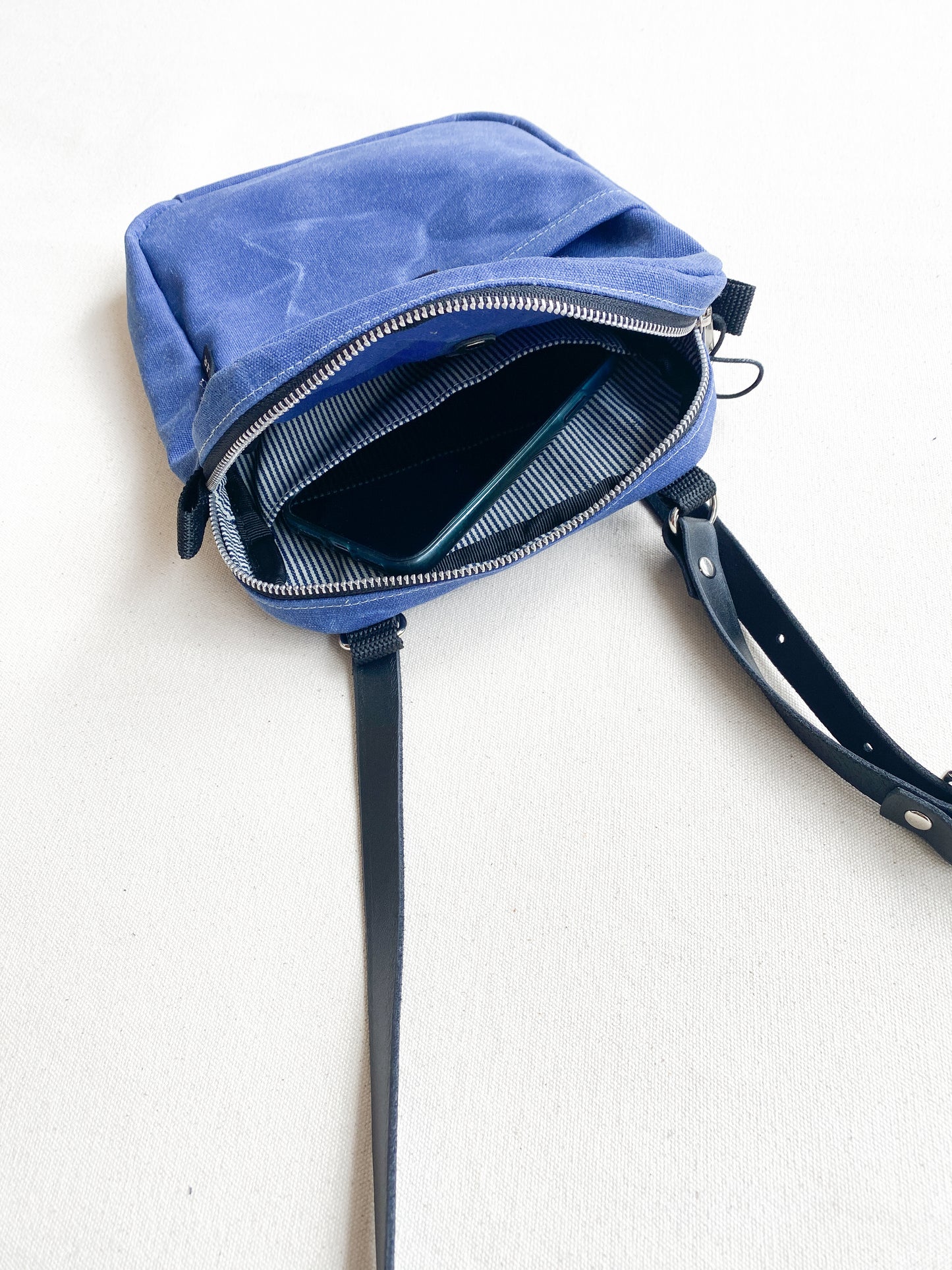 Railroad denim striped lining inside handmade waxed canvas mini messenger bag