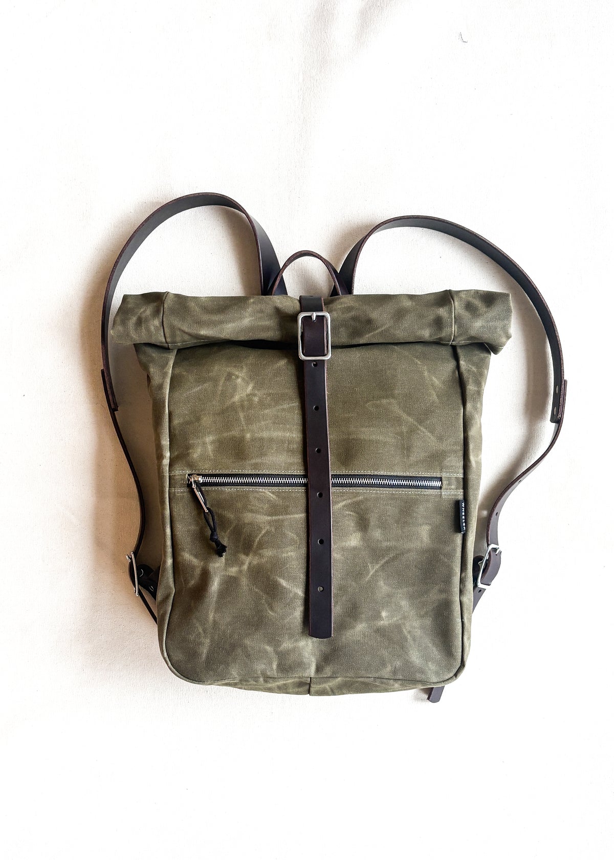 Olive Waxed Canvas backpack with dark brown leather. Handmade in Oregon