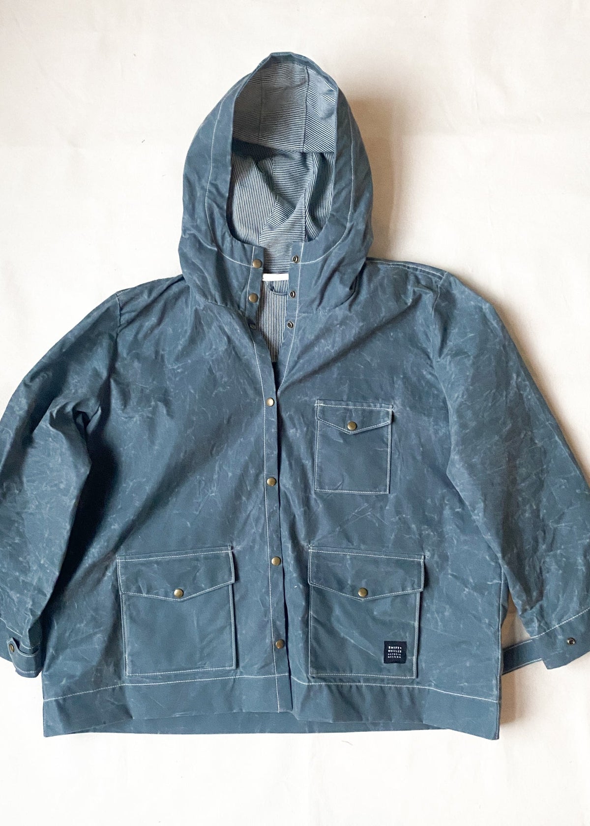 Buttoned Waxed Canvas Raincoat in Slate.