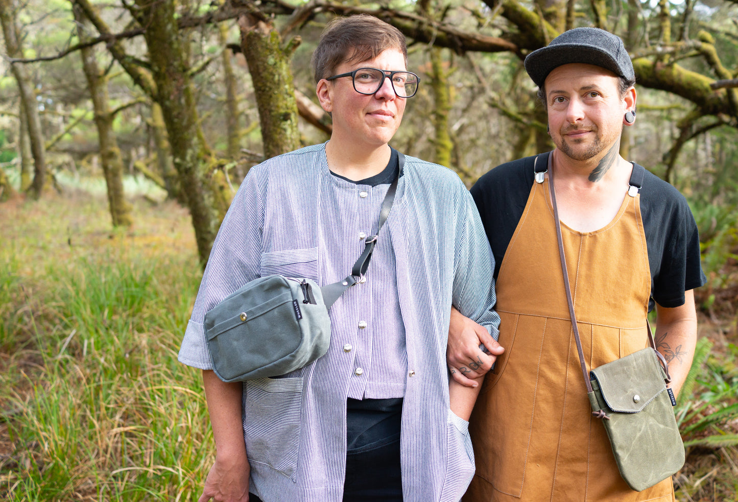 A queer couple decked out in Shift + Wheeler goods. All handmade in Astoria, Oregon, USA
