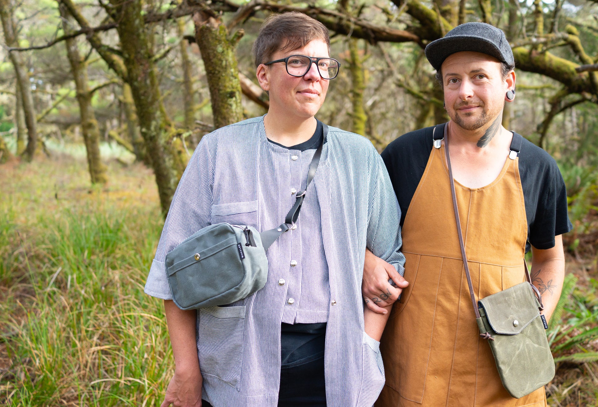A queer couple decked out in Shift + Wheeler goods. All handmade in Astoria, Oregon, USA