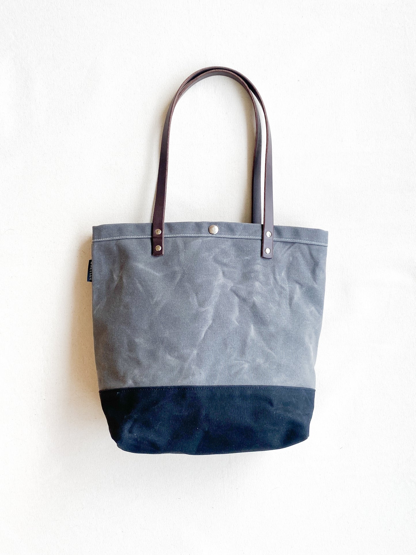 Grey and black minimal tote with leather handles