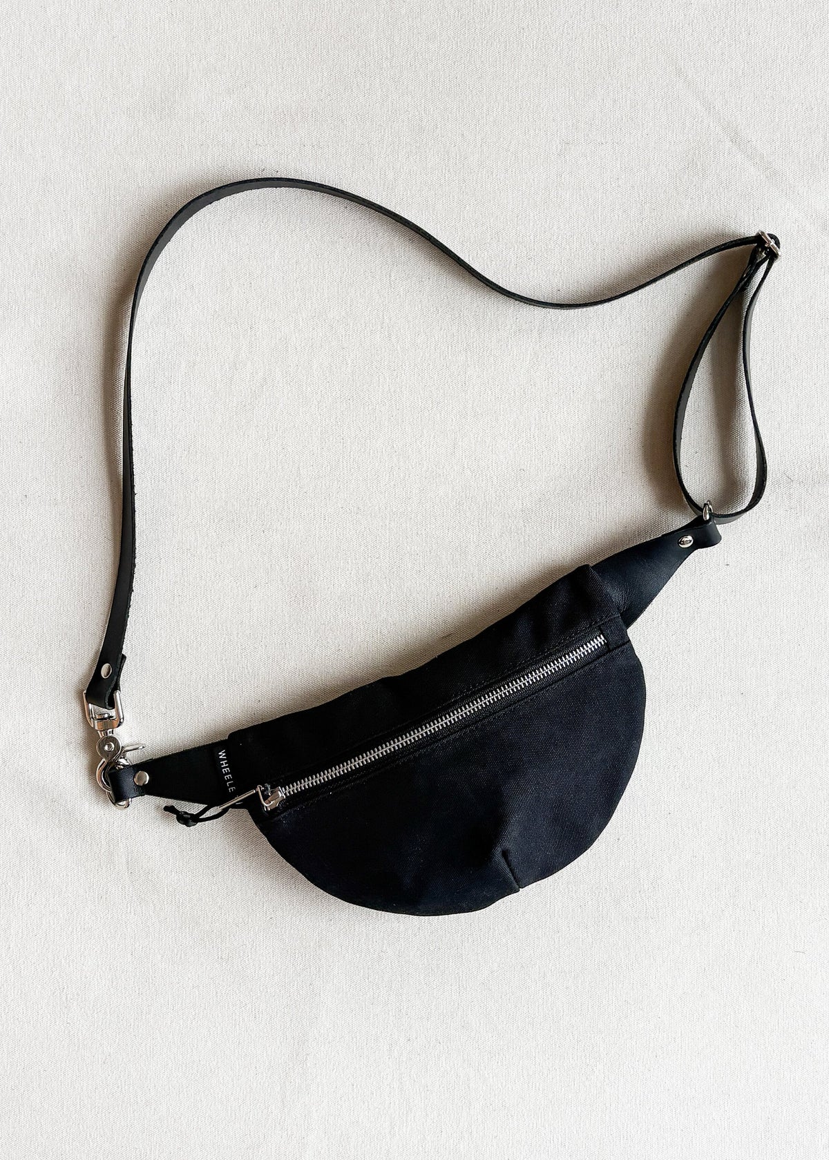 Handmade waxed canvas fanny pack in black
