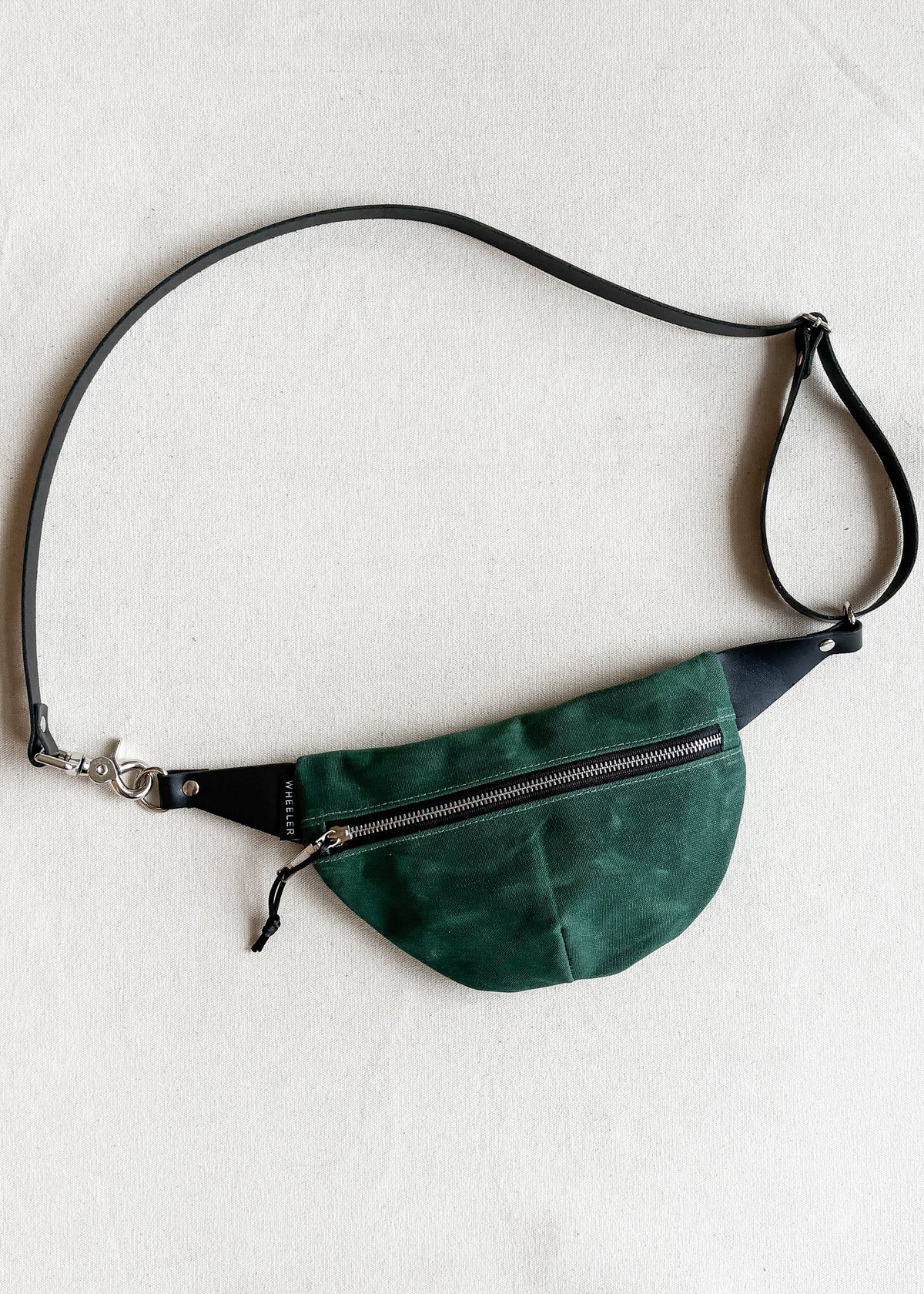 Handmade waxed canvas fanny pack in hunter green