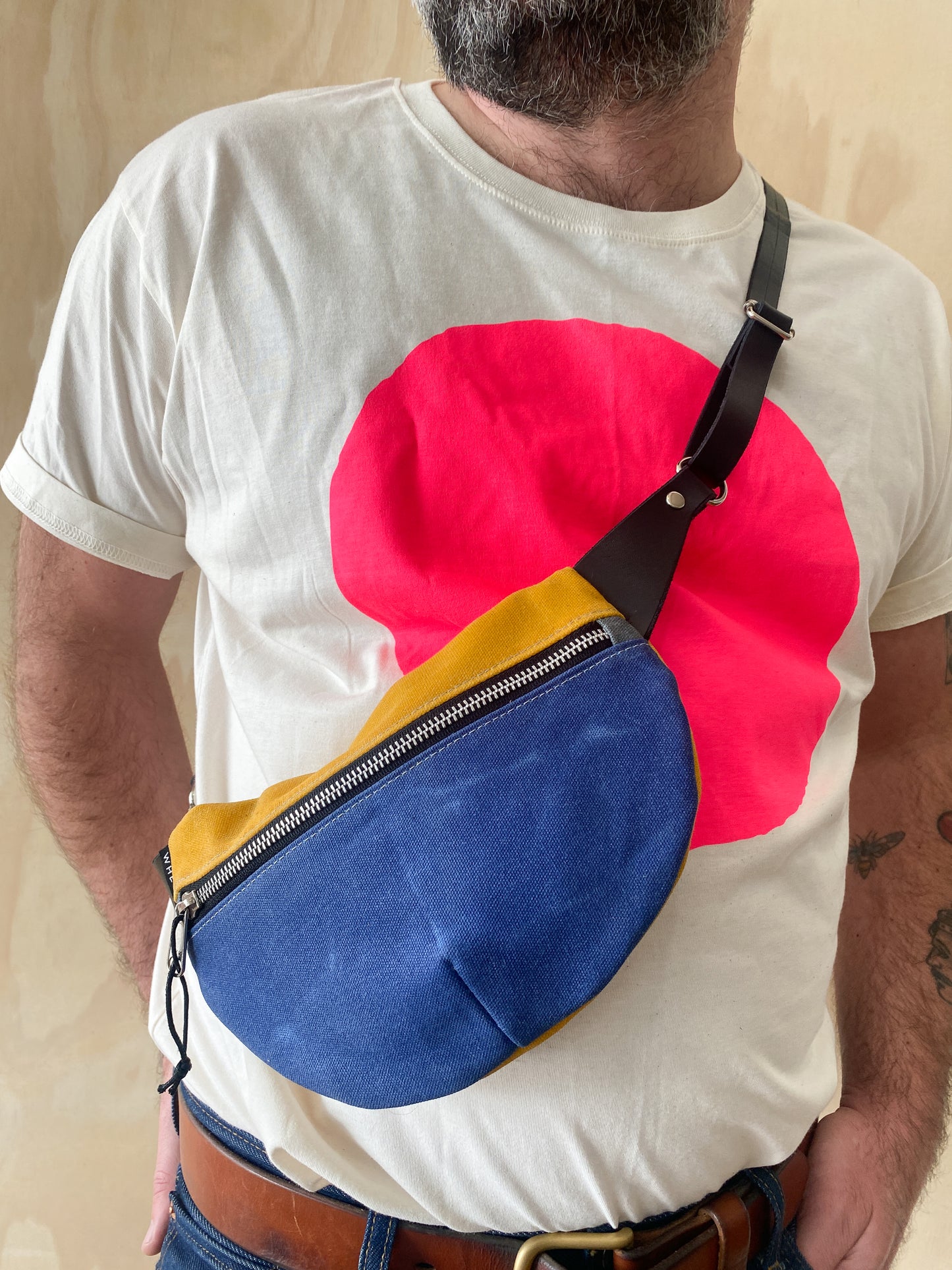 close-up of 3/4" adjustable leather strap on waxed canvas fanny pack