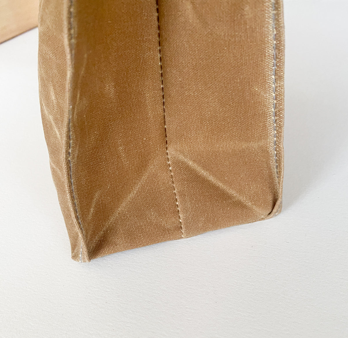 Corner detail of waxed canvas lunch bag