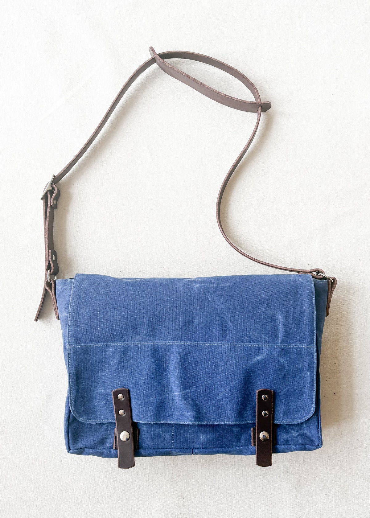 Royal waxed canvas messenger bag with brown leather straps