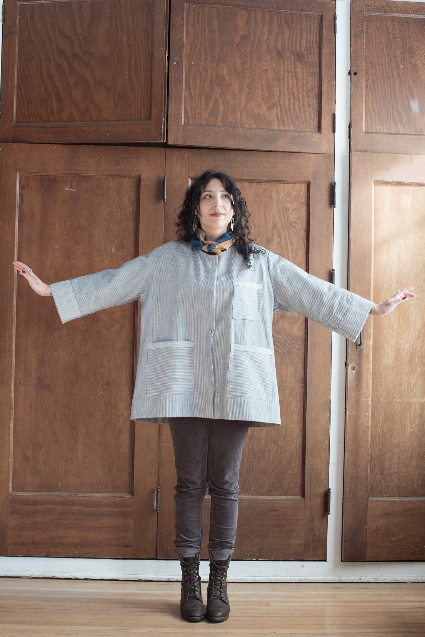Model wearing Lab Coat, buttoned. 