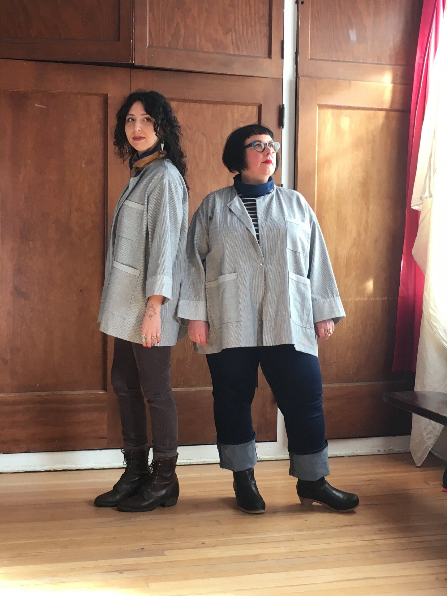 Lab coat, featured on two models. 