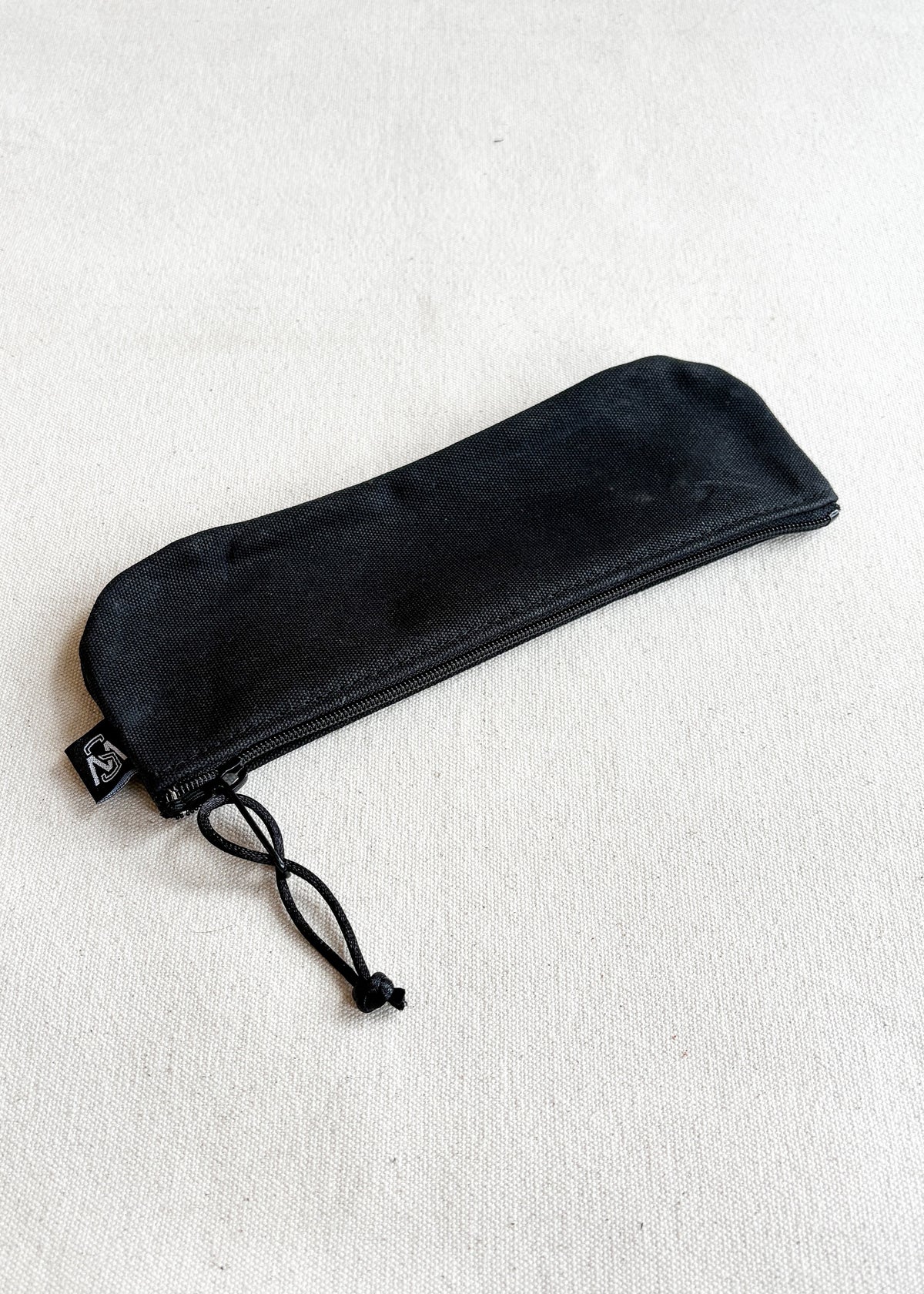 Shift + Wheeler waxed canvas pencil pouch in black