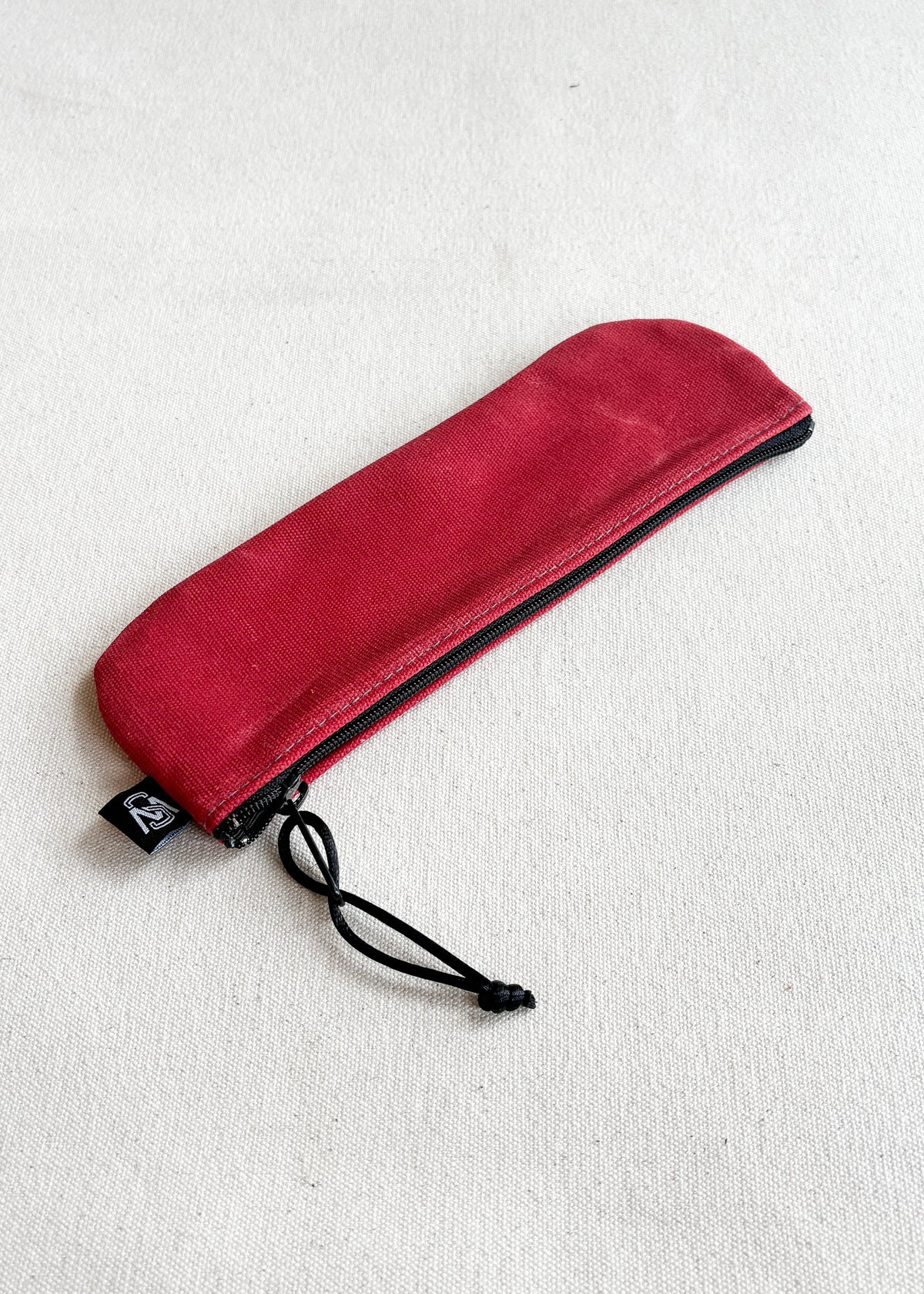 Shift + Wheeler waxed canvas pencil pouch in red