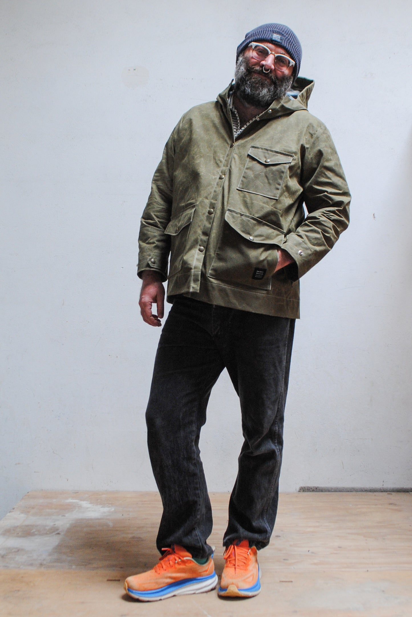 Olive waxed canvas rain jacket, handmade in Astoria Oregon, front view