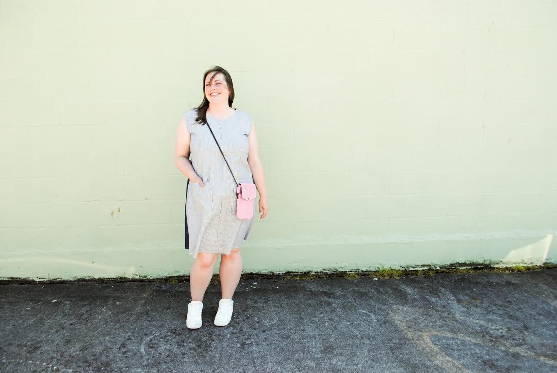 Model wearing Denim Play Dress & Wheeler Bag Co. Simple Crossbody Bag.