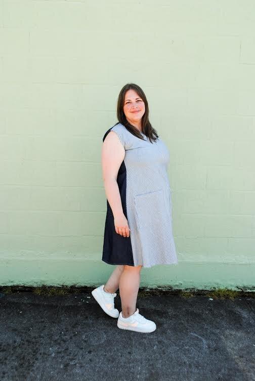 Side view of Denim Play Dress on model. 