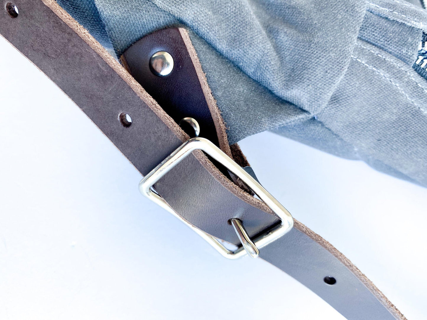 Backpack strap & buckle detail.
