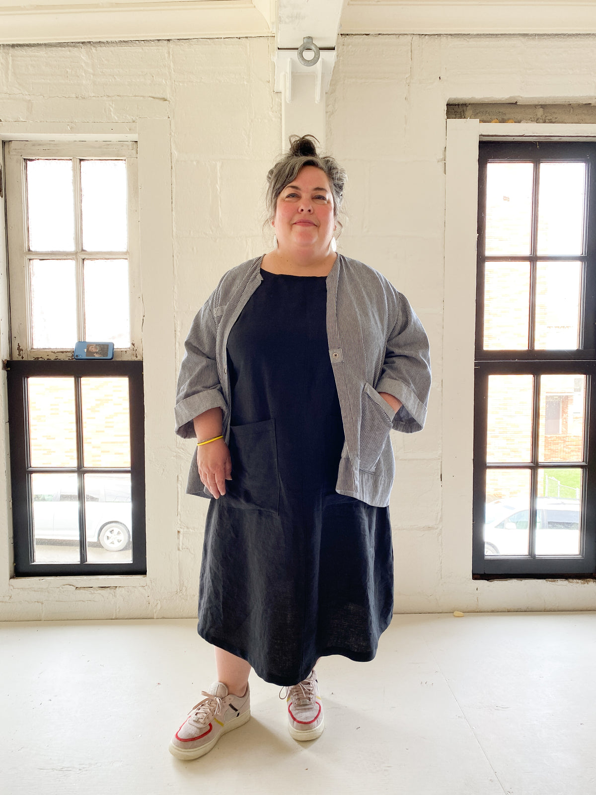 Black linen A Line basic dress layered with lab coat, styled by Shift + Wheeler
