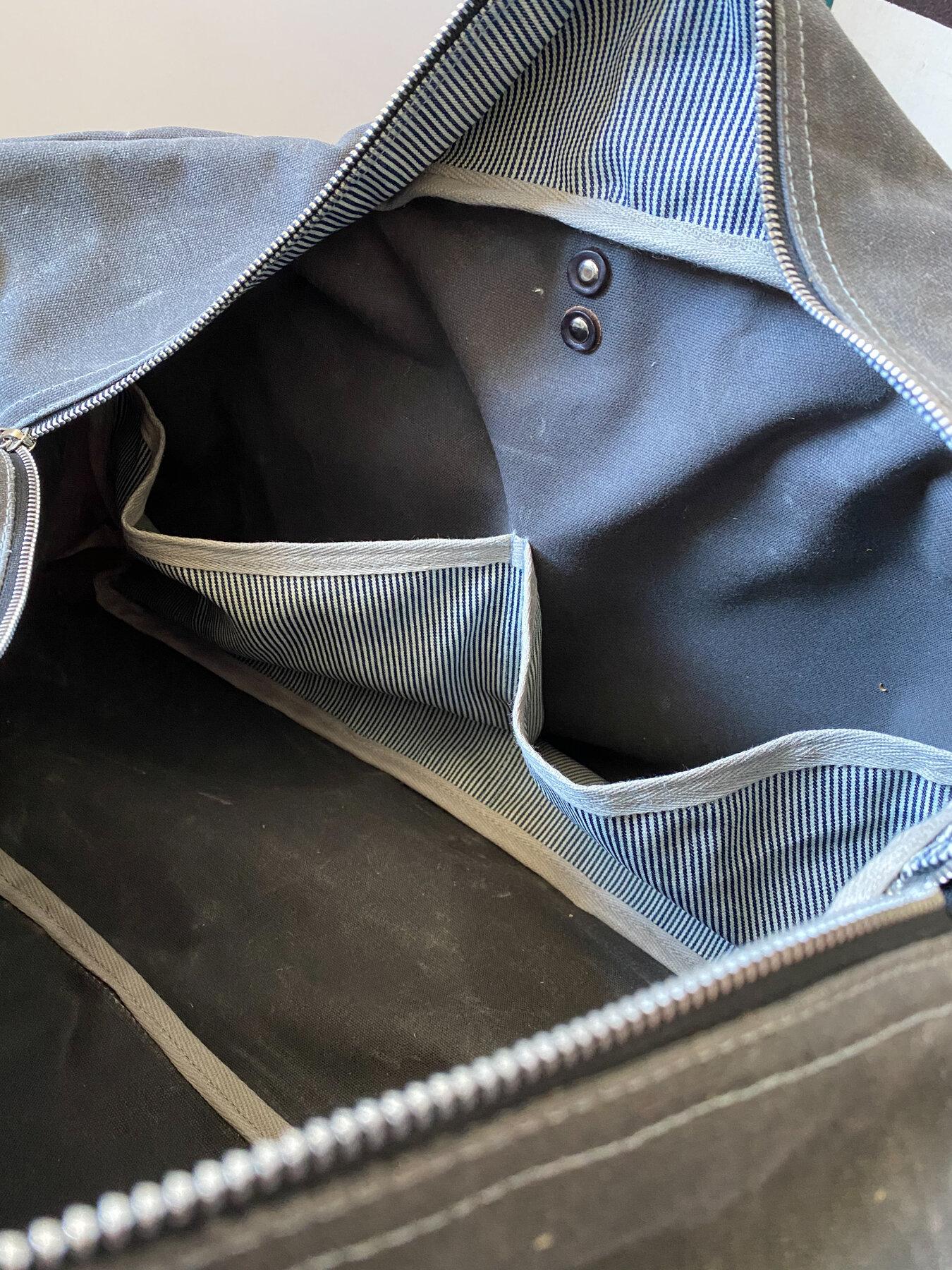 Waxed canvas duffel bag interior, railroad denim pockets detail.