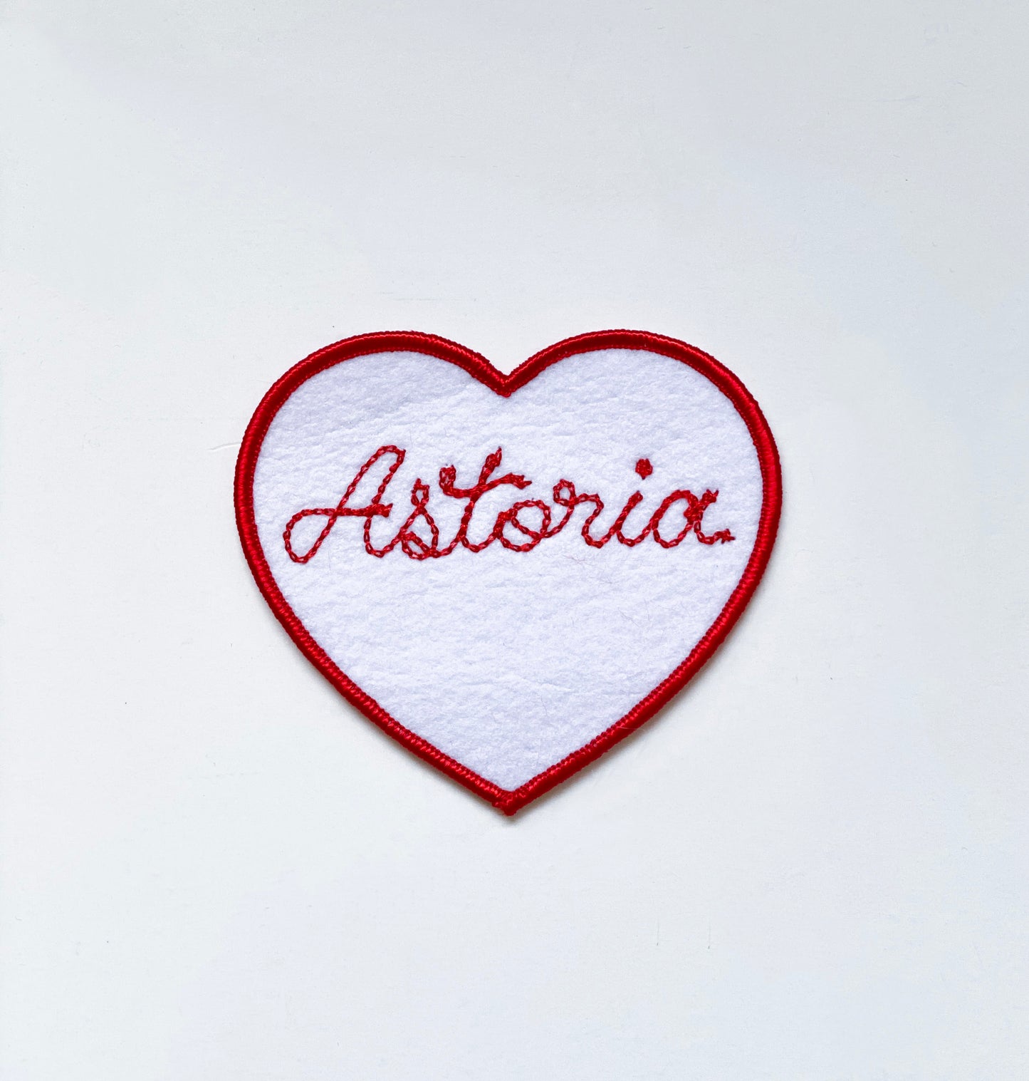 Handmade, custom "Astoria" patch in white felt with red embroidery. 