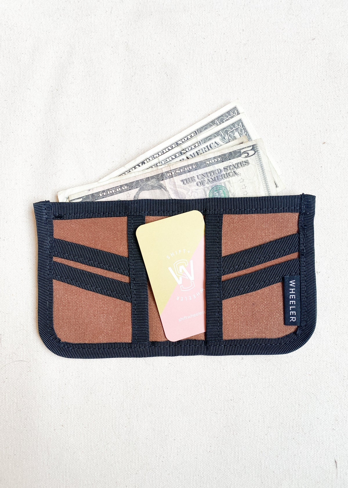 Inside view of waxed canvas wallet in brown