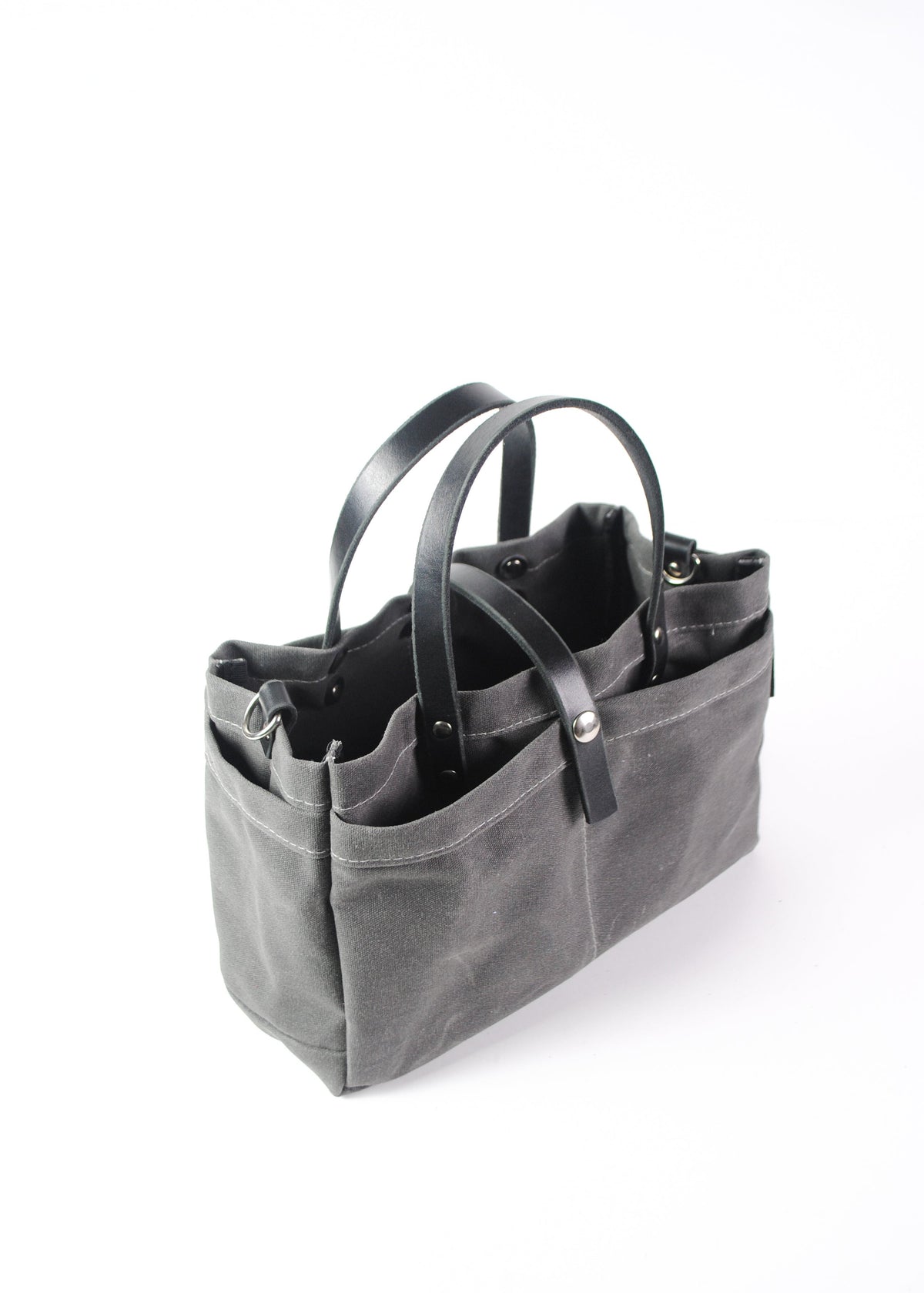 Charcoal, waxed cotton canvas tool bag, side view.