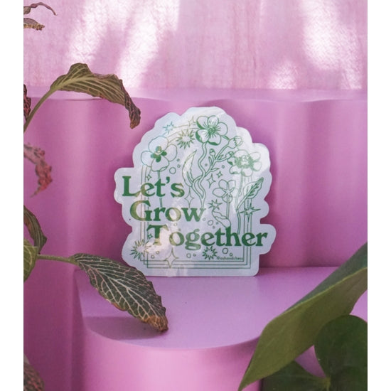 "Let's Grow Together" sticker.